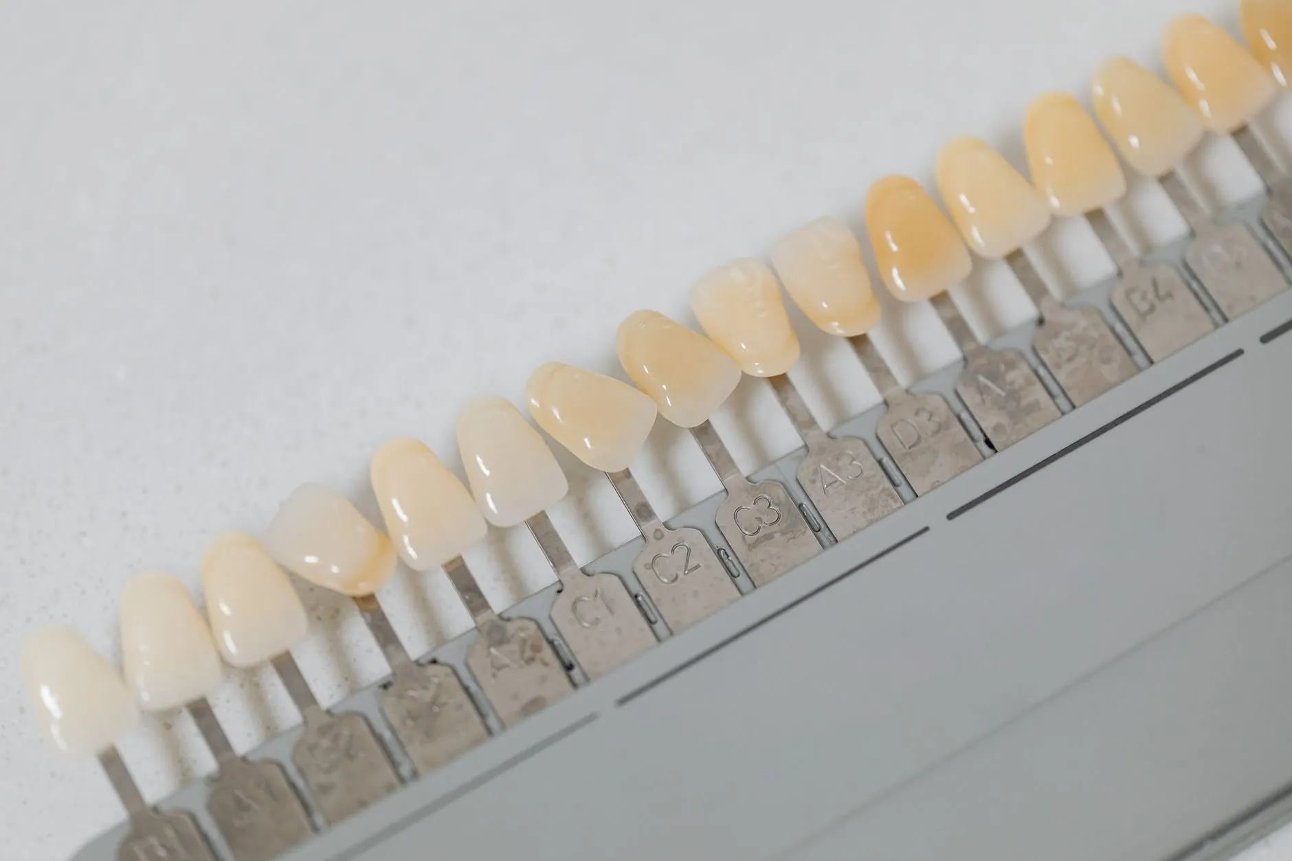 A row of porcelain shade tabs on a white clinic tray